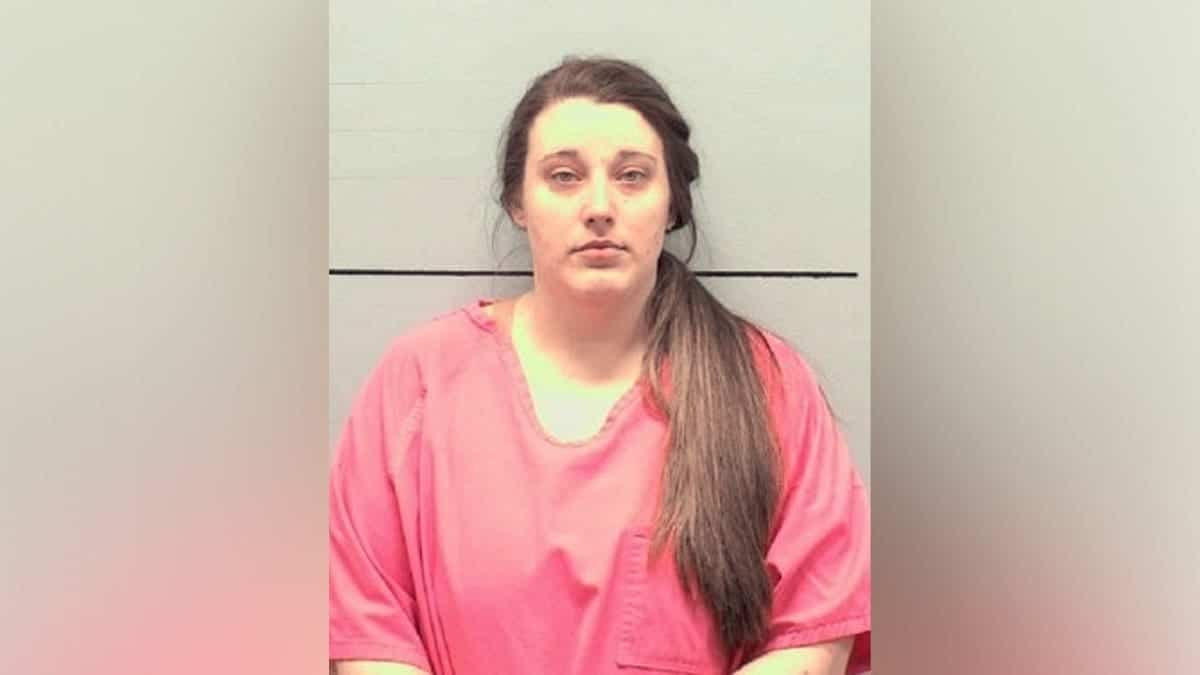 Mugshot of Jessica Patrick Finley wearing a pink jail uniform.