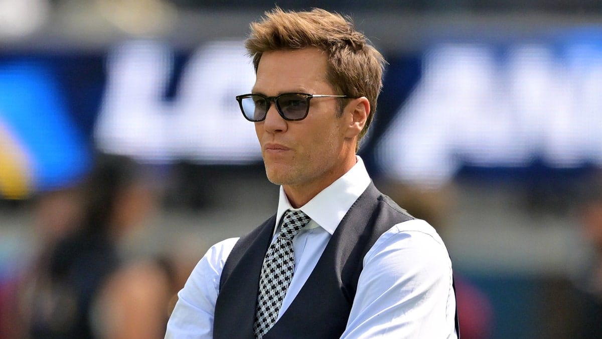 Tom Brady looking on before a football game at SoFi Stadium