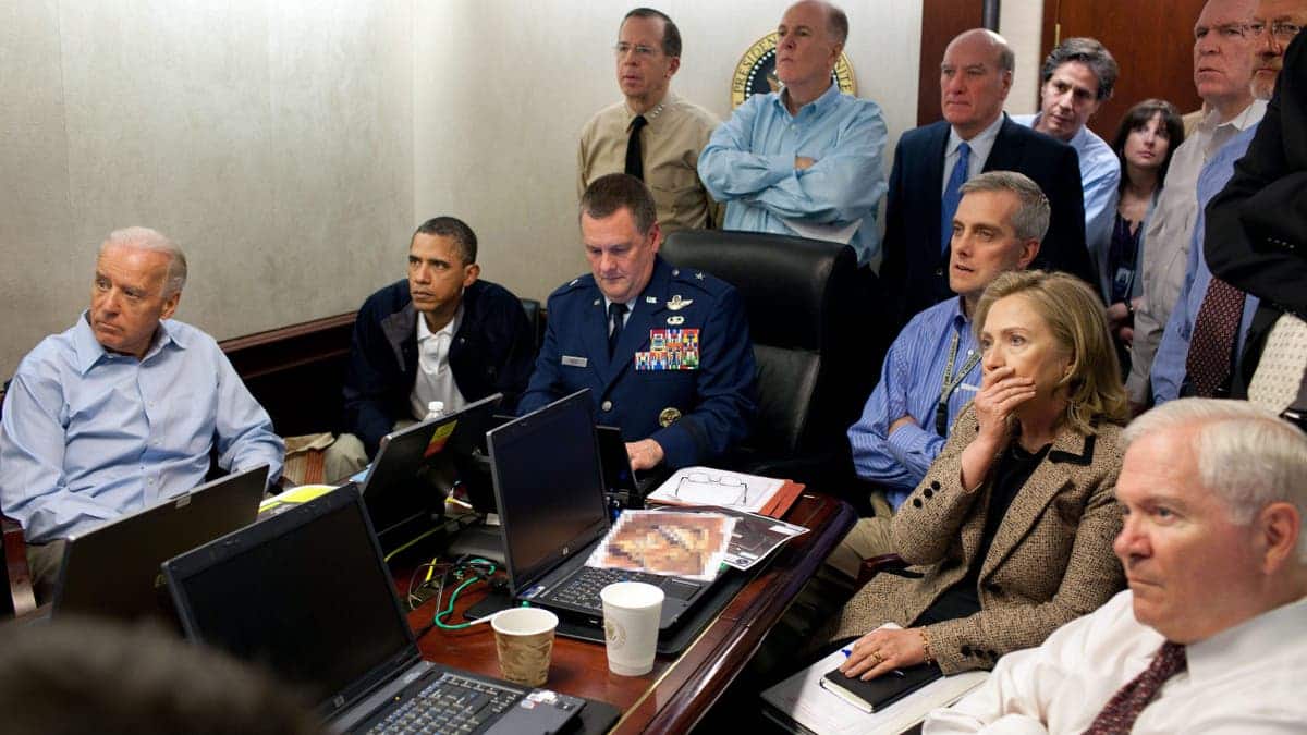 President Barack Obama, Vice President Joe Biden, and Secretary of State Hillary Clinton seated in the White House Situation Room
