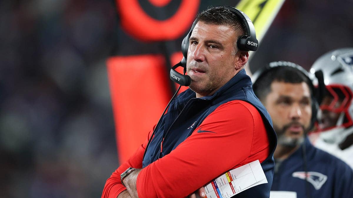 New England Patriots head coach Mike Vrabel standing on sidelines at MetLife Stadium.
