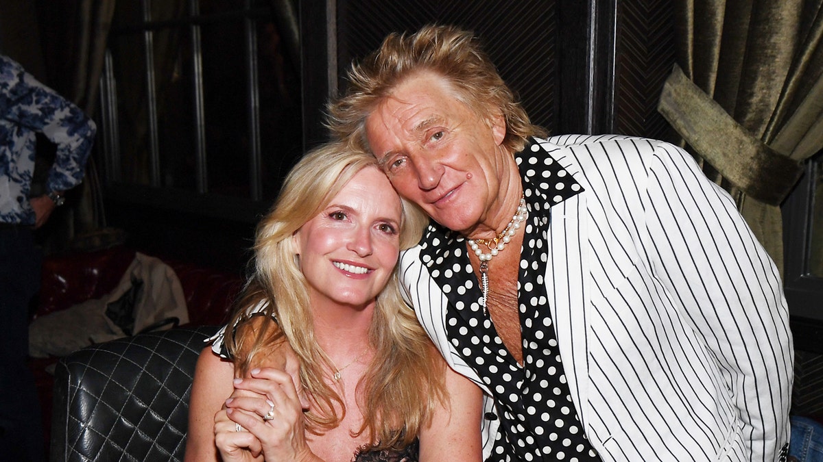 Penny Lancaster Stewart and Sir Rod Stewart celebrating at The Barbershop Cuts & Cocktails in Las Vegas