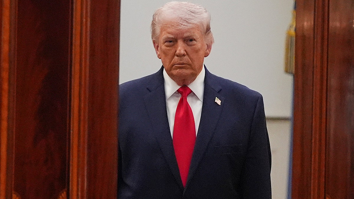 President Donald Trump speaking about the Iran war from the Cross Hall of the White House.