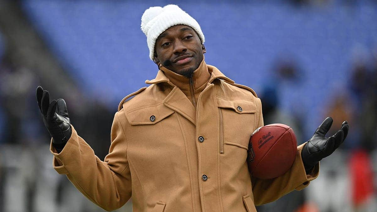 ESPN analyst Robert Griffin III reacting on sidelines at M&T Bank Stadium