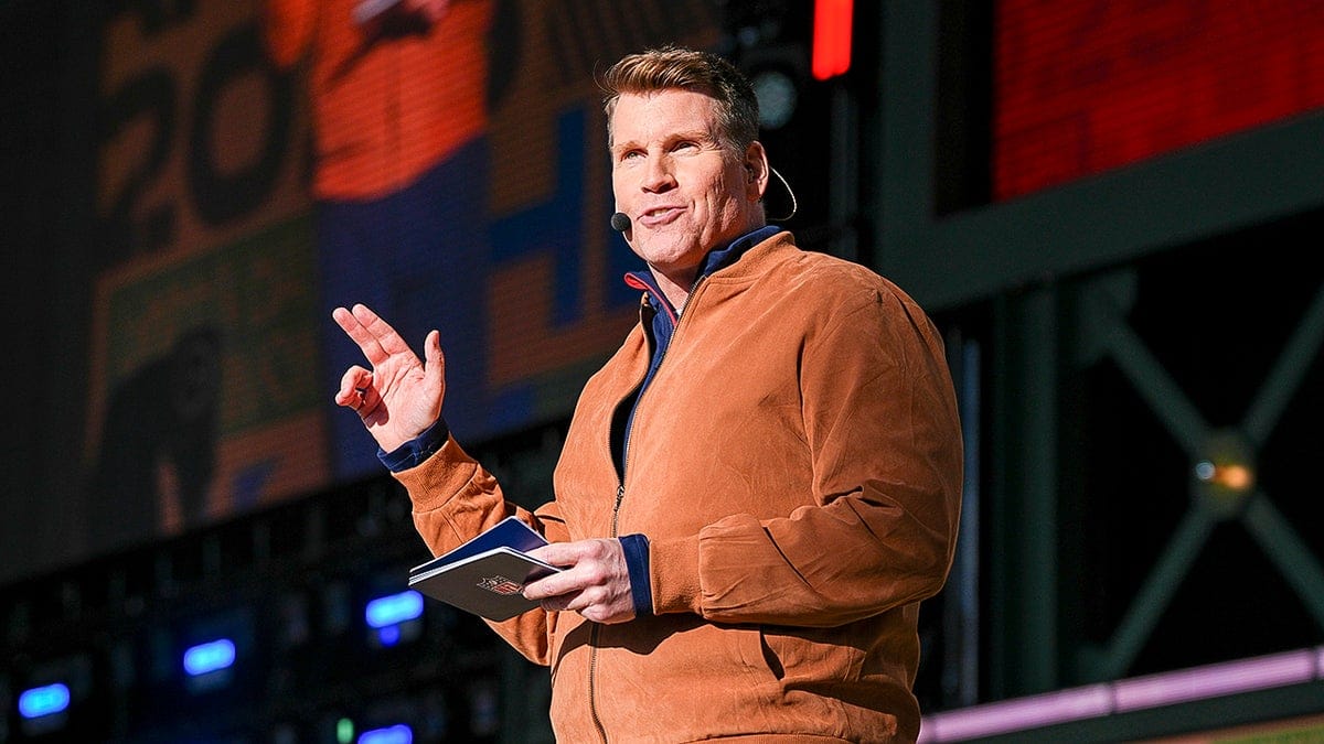 Scott Hanson speaking on stage at the 2025 NFL Draft in Green Bay Wisconsin