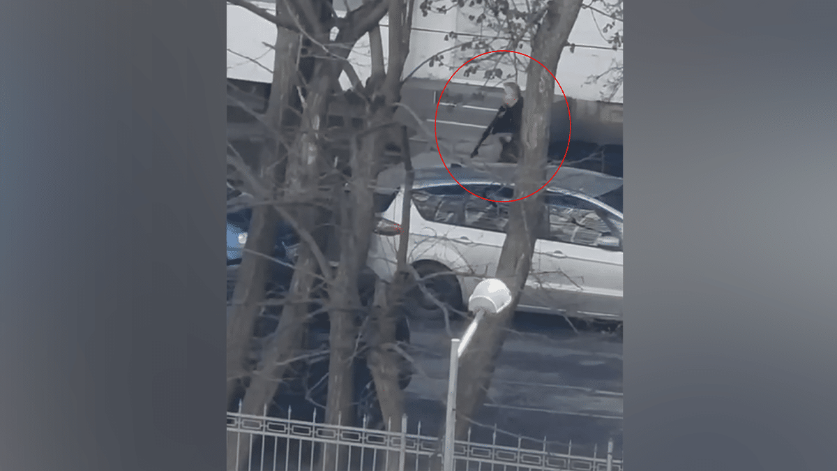 The gunman was seen walking with a weapon on the street.