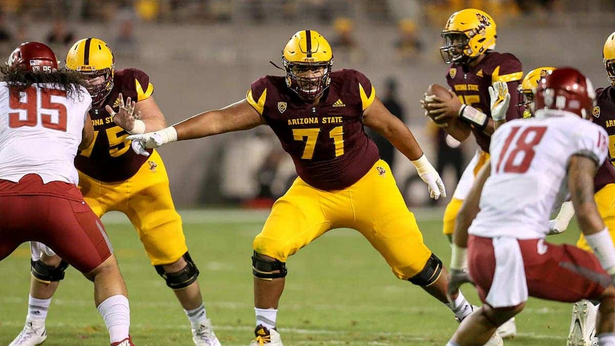Arizona State Sun Devils offensive lineman Steven Miller blocking during football game at Sun Devil Stadium