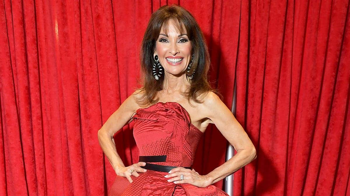 Susan Lucci posing in a red dress backstage at Hammerstein Ballroom in New York City