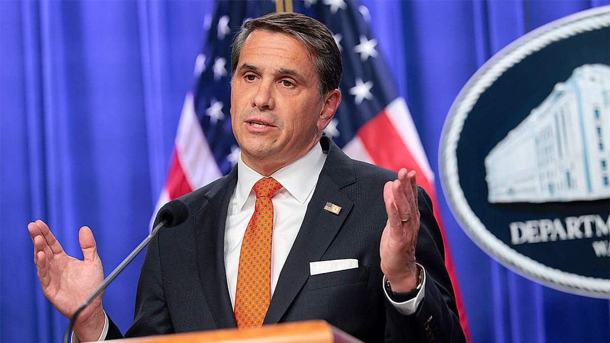 Acting U.S. Attorney General Todd Blanche speaking at a news conference indoors