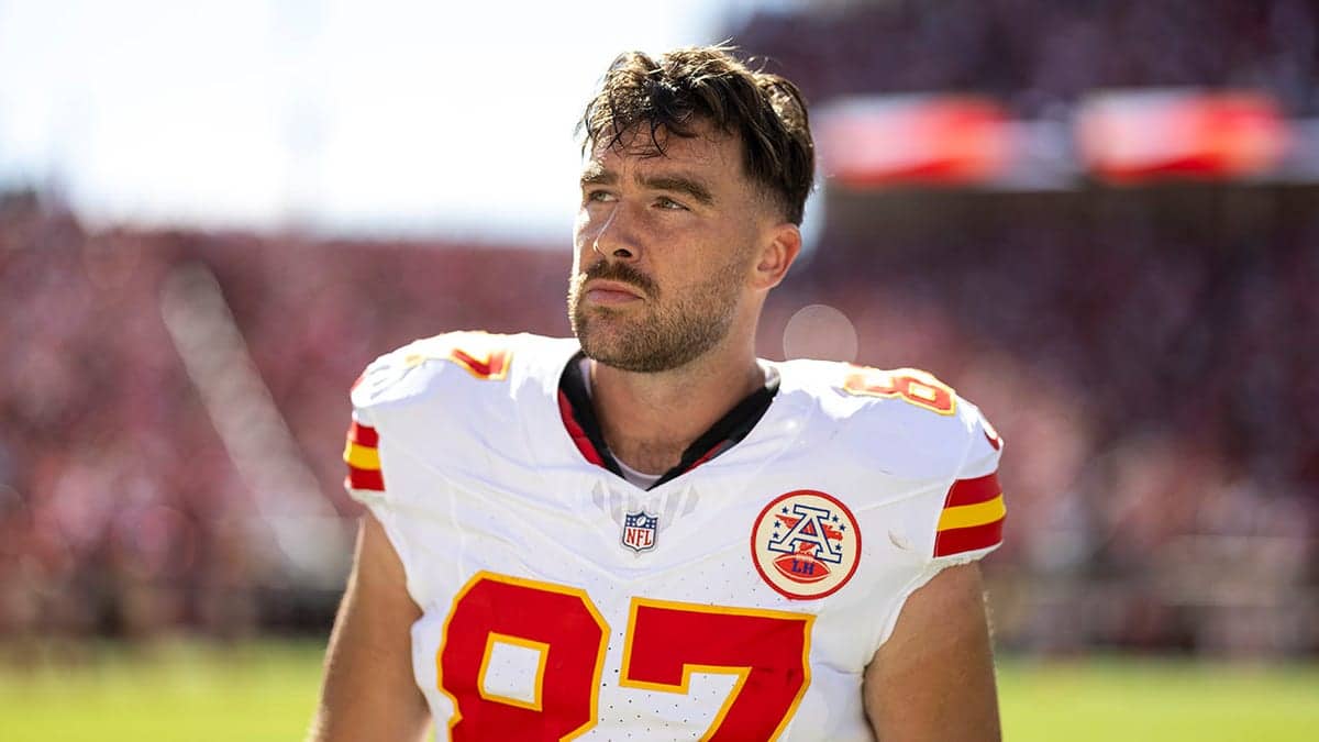 Travis Kelce wearing number 87 looks on during an NFL game at Levi's Stadium.