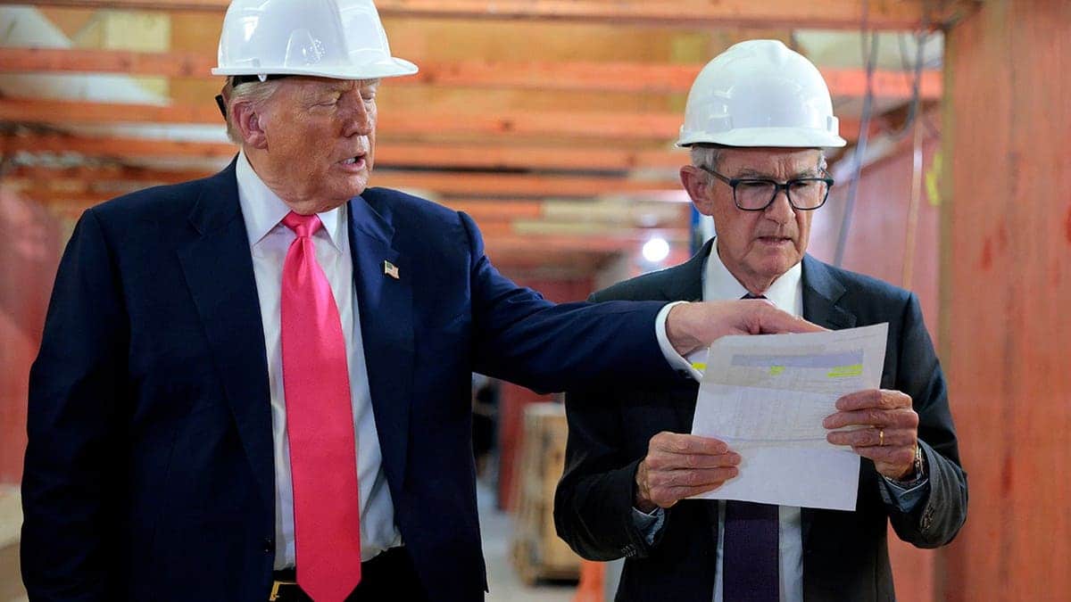 U.S. President Donald Trump and Federal Reserve Chair Jerome Powell wearing hard hats touring Federal Reserve headquarters renovation