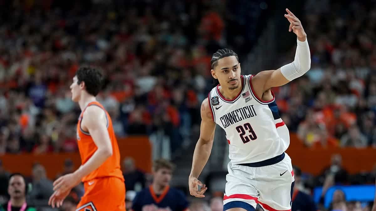 UConn forward Jayden Ross celebrating a shot during a basketball game.