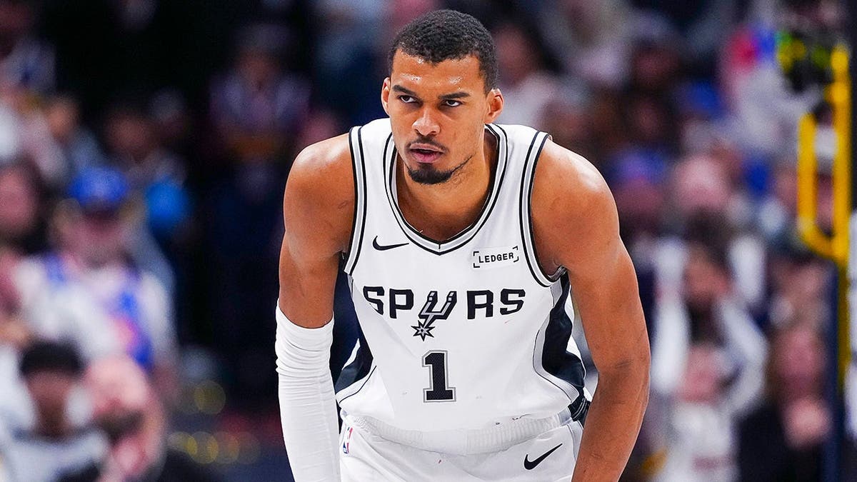 San Antonio Spurs forward Victor Wembanyama dribbling basketball during game at Ball Arena