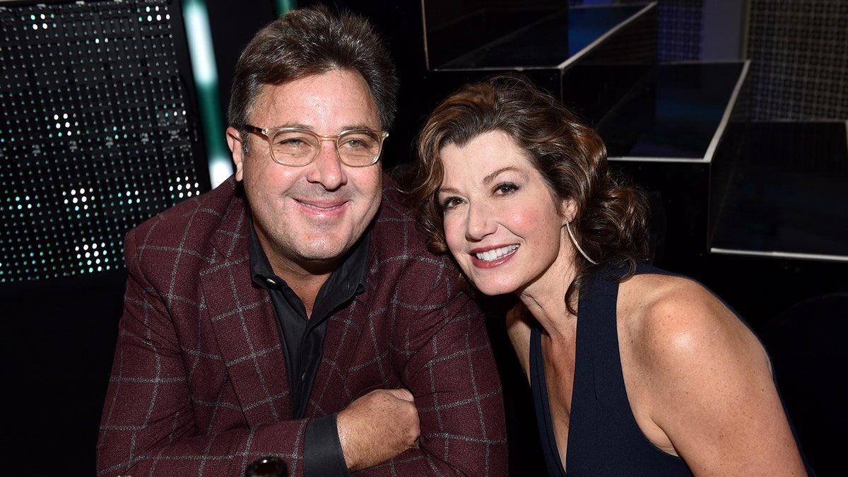 Singer-songwriters Vince Gill and Amy Grant standing together at an event in Nashville