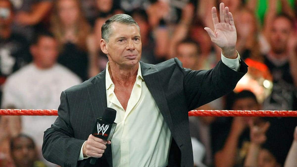 Vince McMahon standing in the wrestling ring at a WWE event in Las Vegas