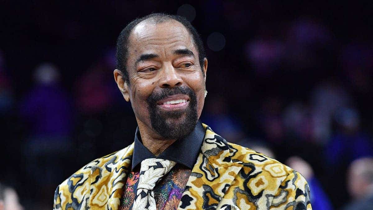 Walt Frazier standing on the basketball court at Wells Fargo Center
