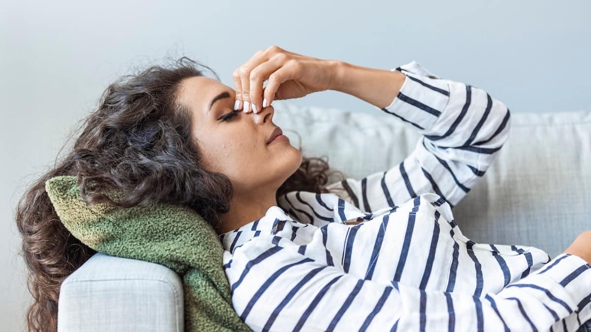 Woman tired on couch