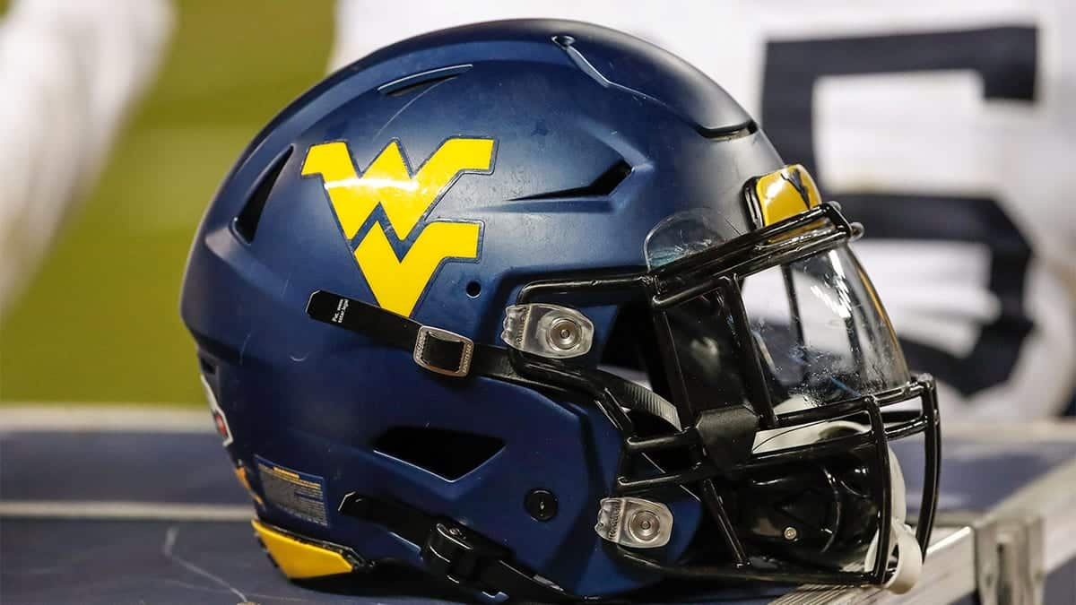 West Virginia Mountaineers logo on a football helmet at a game.