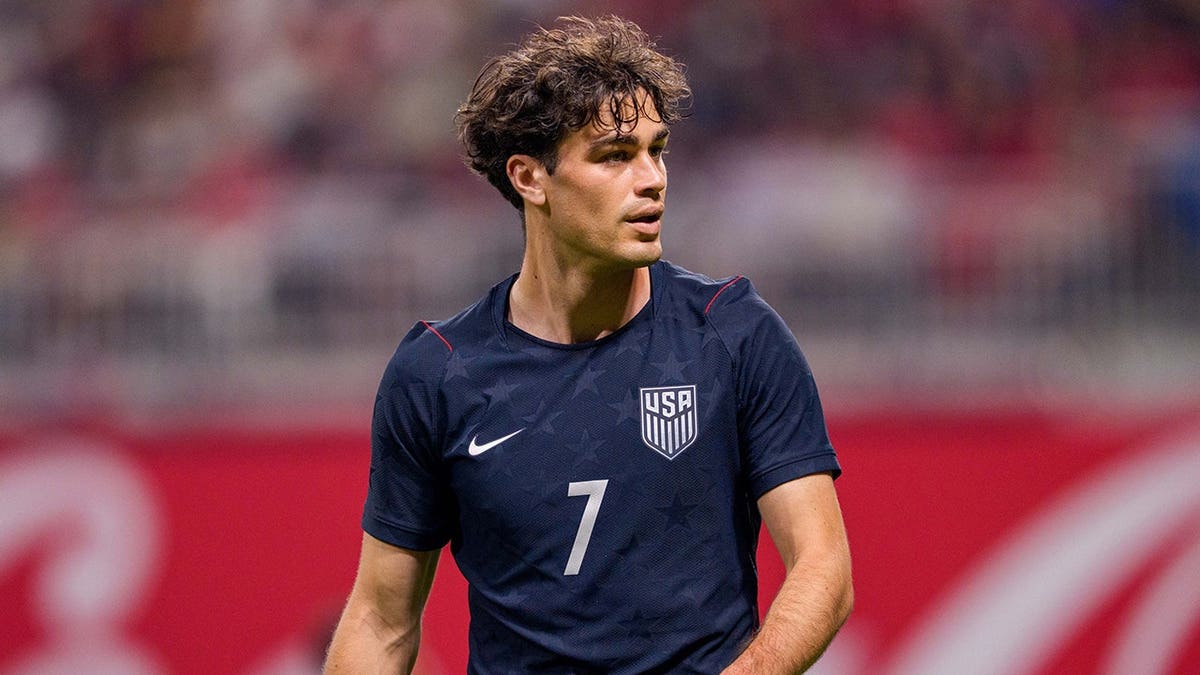 Gio Reyna walking down the pitch during a soccer match in Atlanta