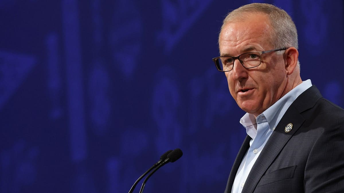 Southeastern Conference Commissioner Greg Sankey listening to a question at media event