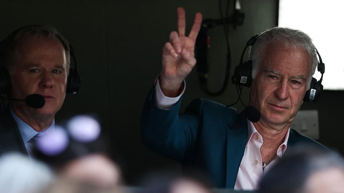 John McEnroe gesturing during Wimbledon men's singles final match