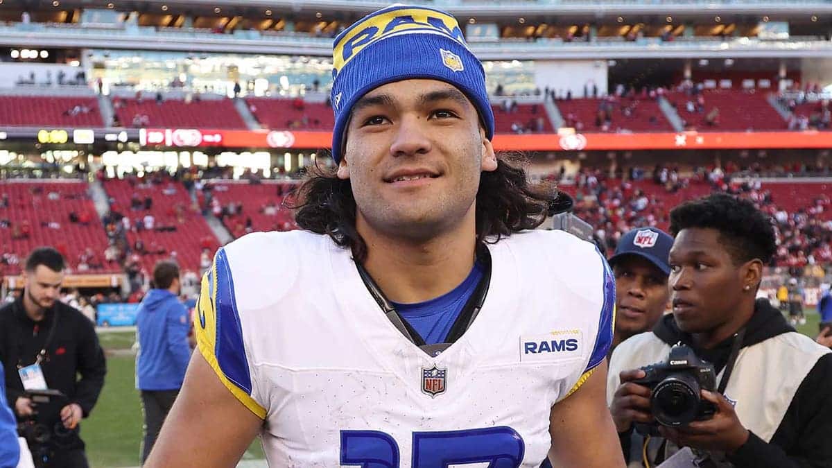 Puka Nacua carrying football during game at Levi's Stadium