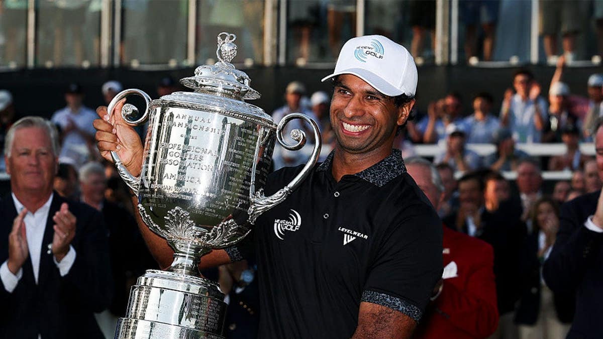 aaron rai with the wanamaker trophy
