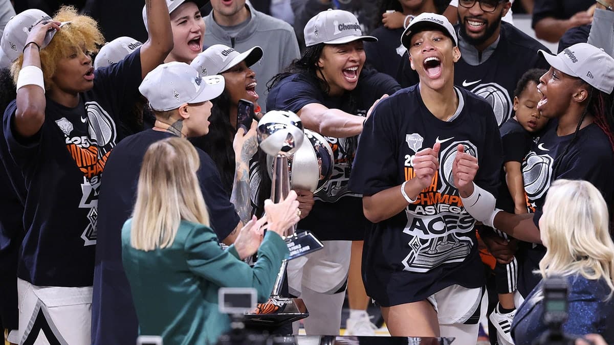 Cathy Engelbert handing MVP award to A'ja Wilson at Mortgage Matchup Center