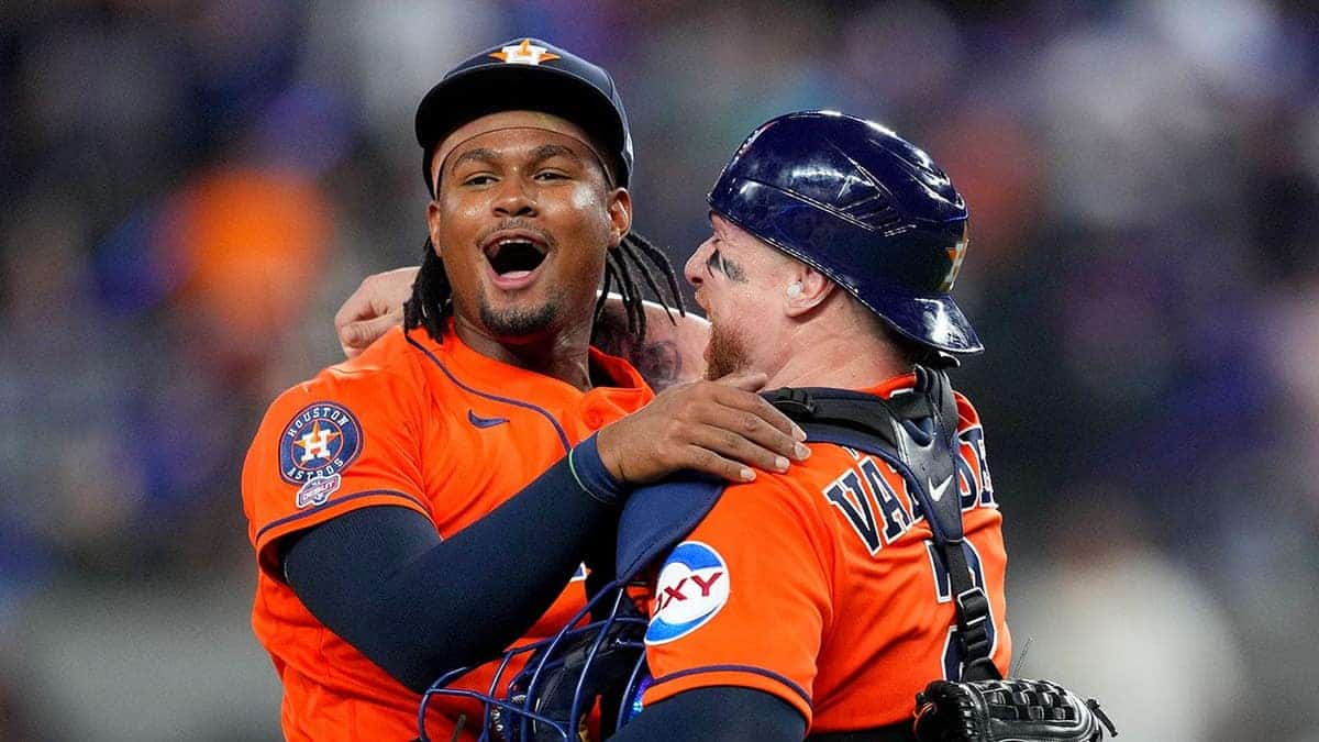 Houston Astros pitcher Alimber Santa and catcher Christian Vázquez celebrating on the field