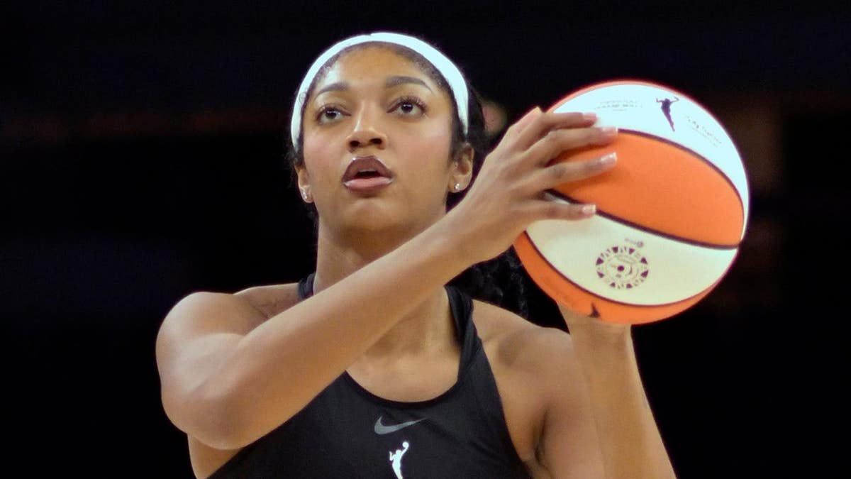 Angel Reese shooting basketball during warm-up at Target Center