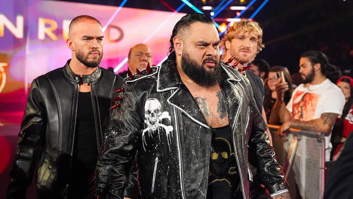 Austin Theory, Bronson Reed and Logan Paul entering the wrestling ring at Xfinity Mobile Arena