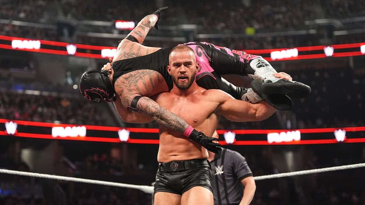 Austin Theory wrestling Rey Mysterio in a WWE match at Kia Center Orlando