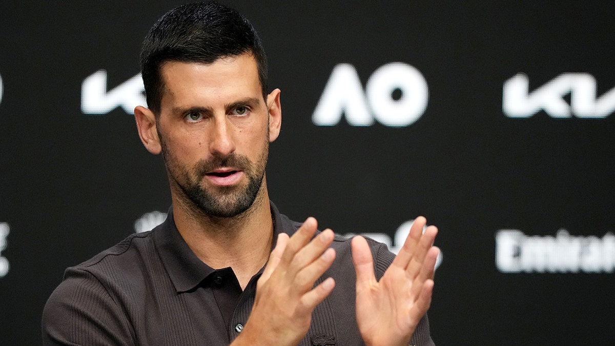Novak Djokovic gesturing during a press conference in Melbourne