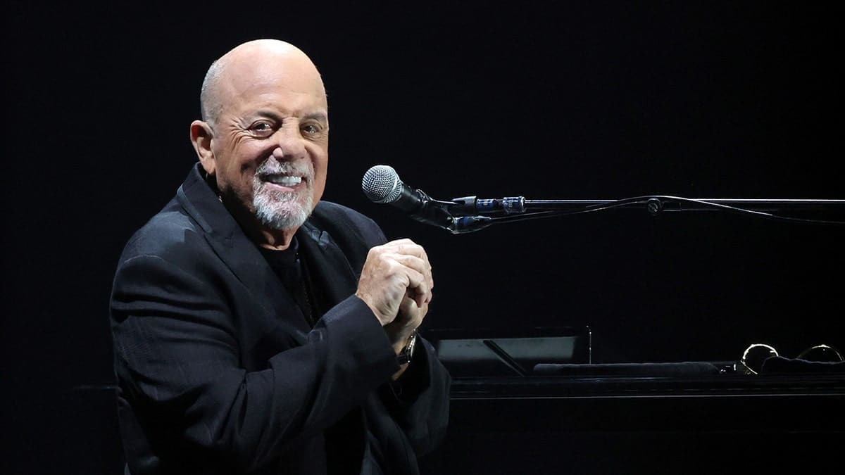 Billy Joel playing piano on stage at Allegiant Stadium in Las Vegas