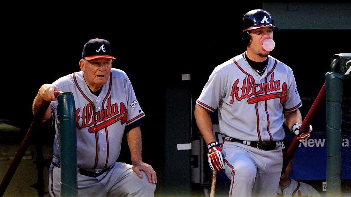 Atlanta Braves manager Bobby Cox and Chipper Jones seated in dugout