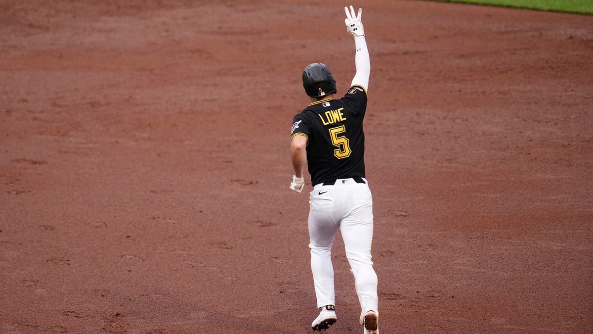 Pittsburgh Pirates' Brandon Lowe rounding bases after hitting home run.