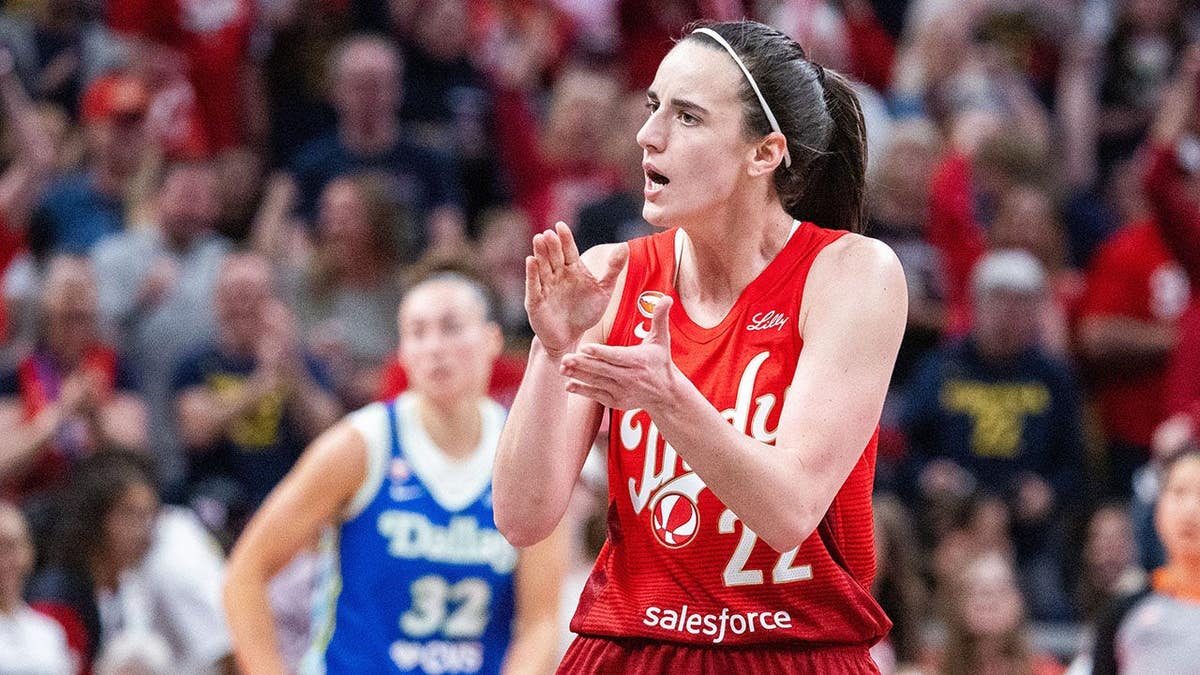 Indiana Fever guard Caitlin Clark celebrating during basketball game at Gainbridge Fieldhouse
