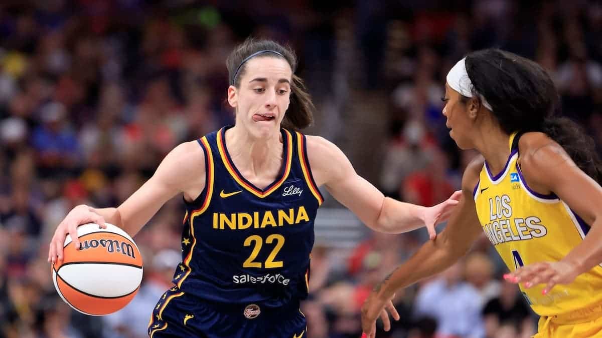 Caitlin Clark defending against Lexie Brown during basketball game at Gainbridge Fieldhouse