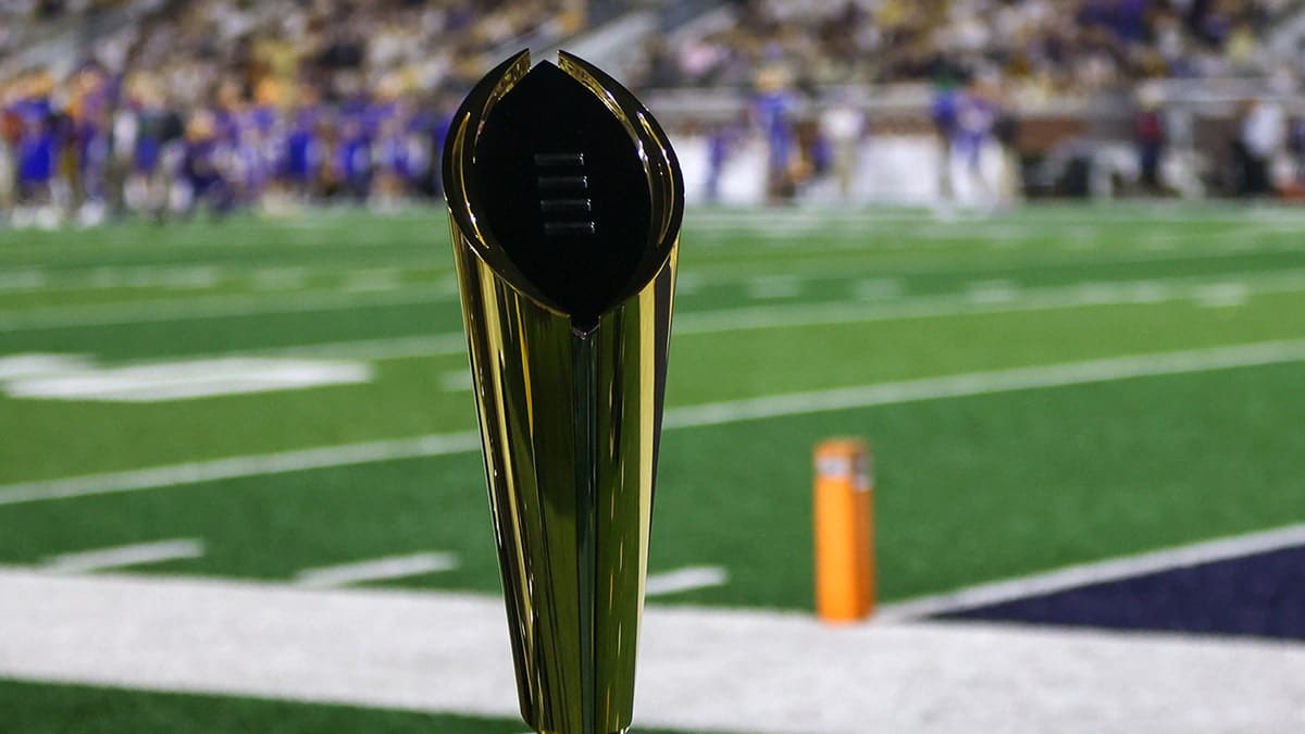 College Football Playoff National Championship trophy on sidelines at Bobby Dodd Stadium