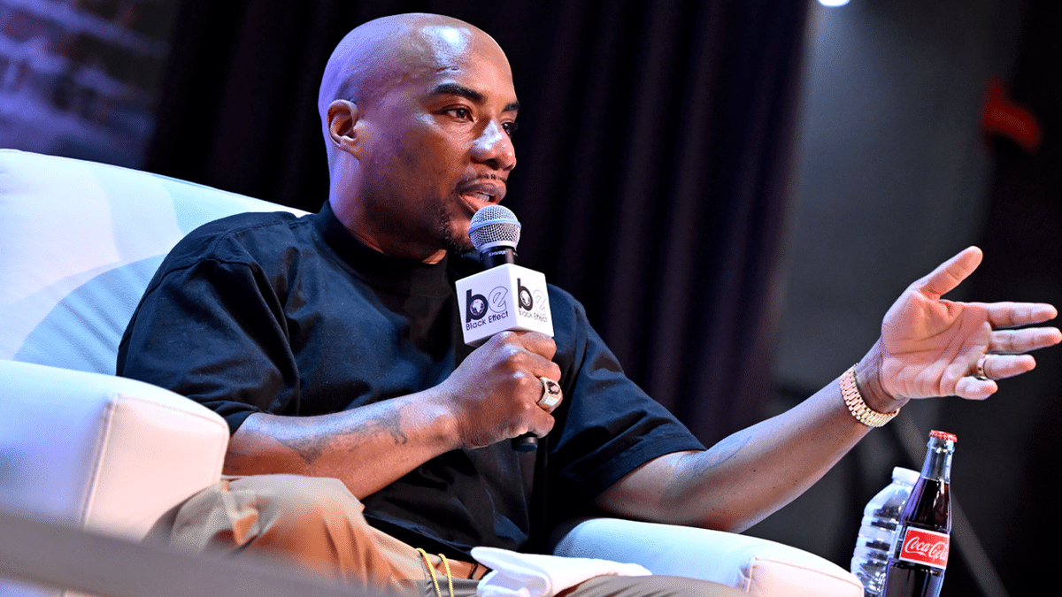 Charlamagne tha God speaking on stage at the Black Effect Podcast Festival in Atlanta, Georgia