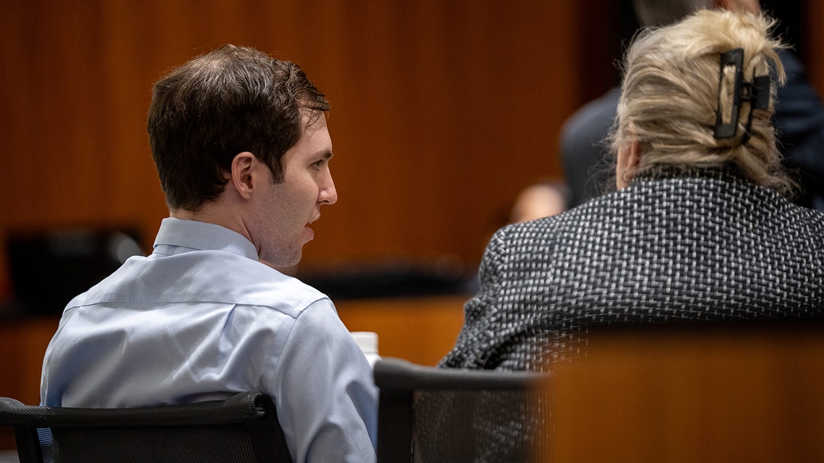 Tyler Robinson and defense attorney Kathryn Nester seated in a courtroom in Provo Utah