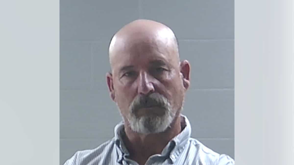 Mugshot of bald man
