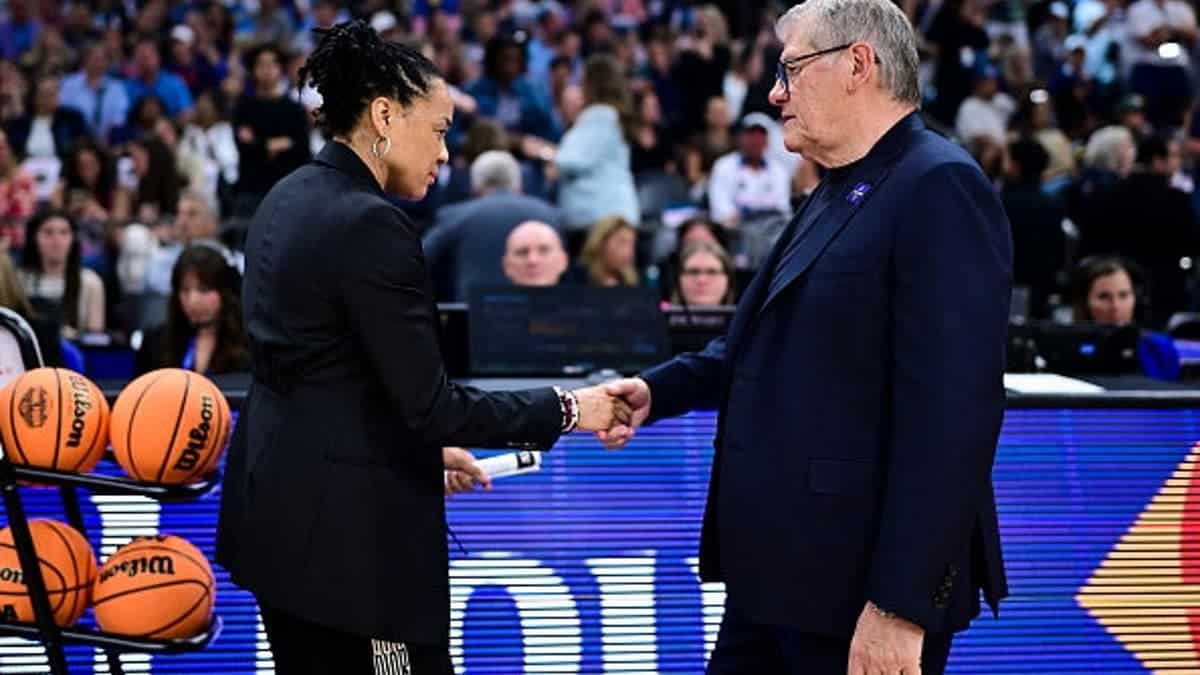 Dawn Staley shaking hands with Geno Auriemma before NCAA Women's Final Four semifinal game in Phoenix