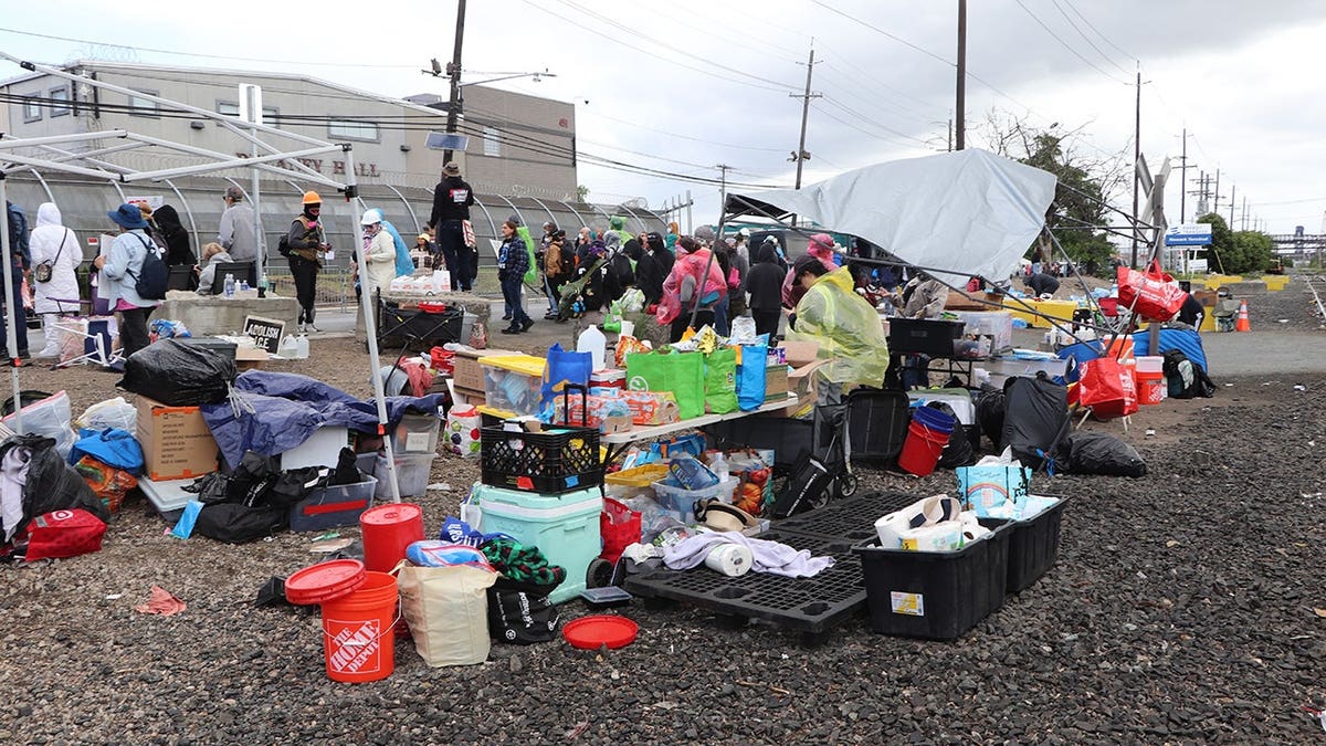 tables and bins of supplies at a protest site
