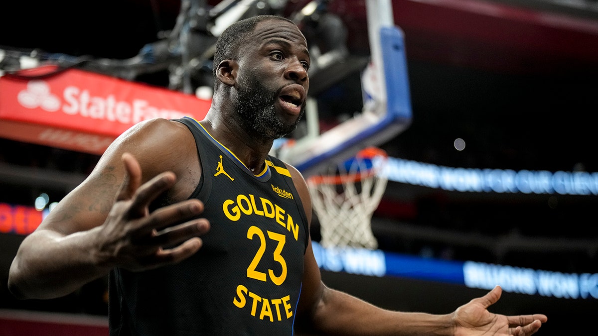 Draymond Green reacting during a basketball game at Little Caesars Arena
