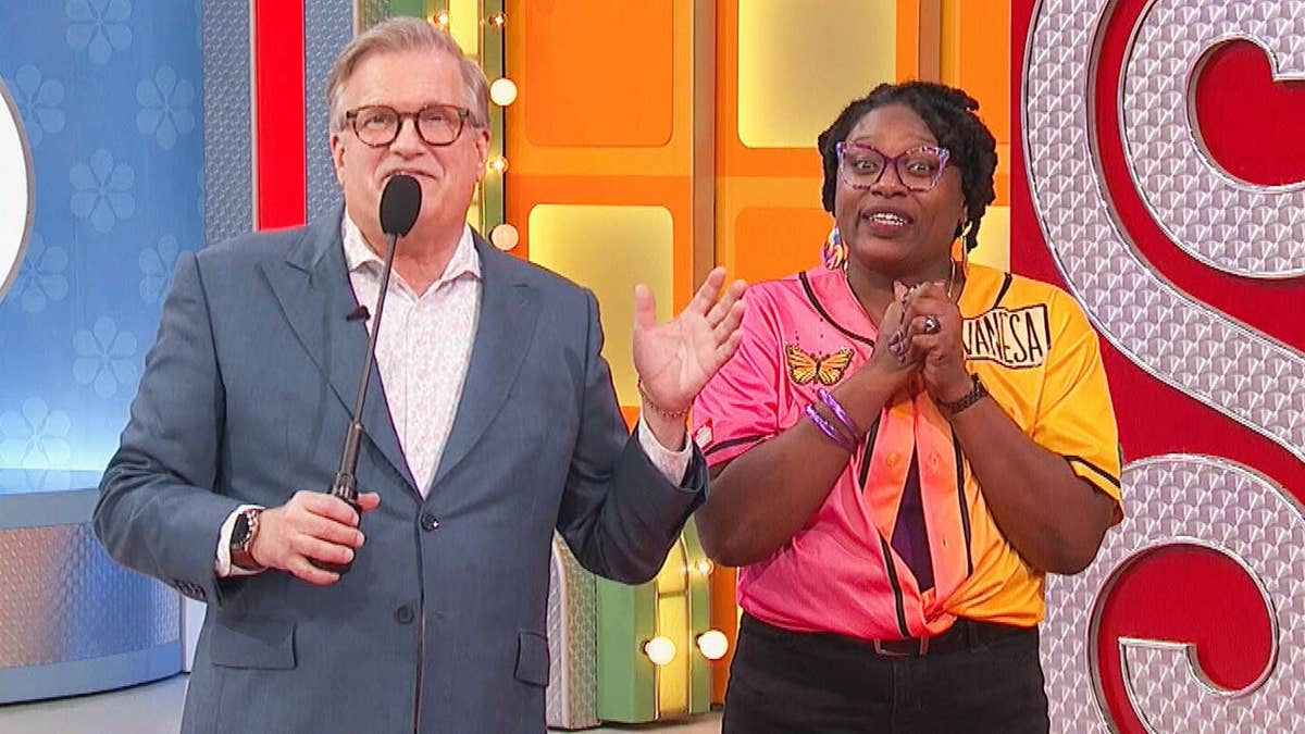 Drew Carey and Vanesa standing on The Price Is Right set