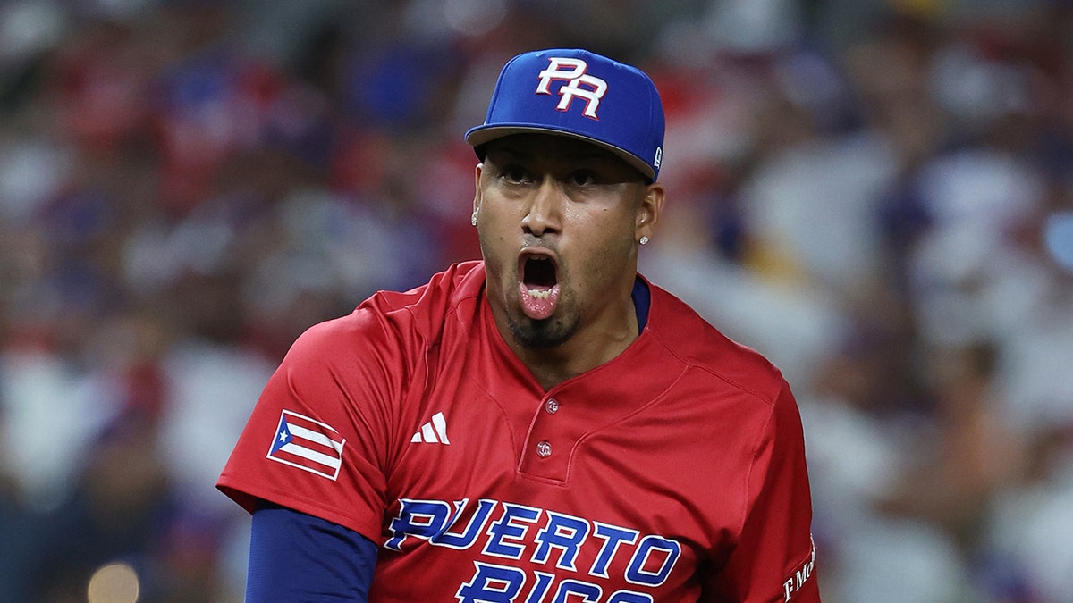 Edwin Diaz of Team Puerto Rico celebrating a strikeout during a baseball game.