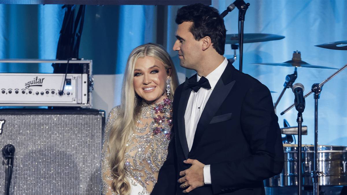 Charlie Kirk and his wife Erika Lane Frantzve standing on stage at the Salamander Hotel in Washington D.C.