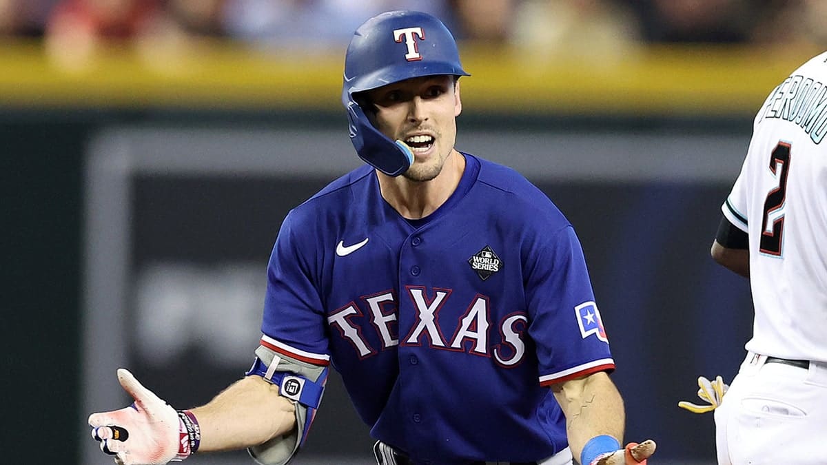 Evan Carter of the Texas Rangers celebrating after hitting a double at Chase Field