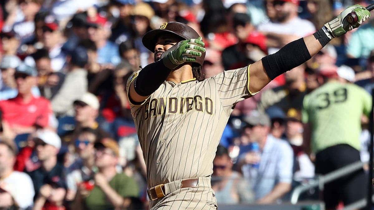 San Diego Padres' Fernando Tatis Jr. hitting a home run during a baseball game.