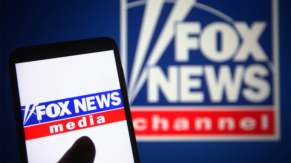 Fox News logo on phone and on a sign